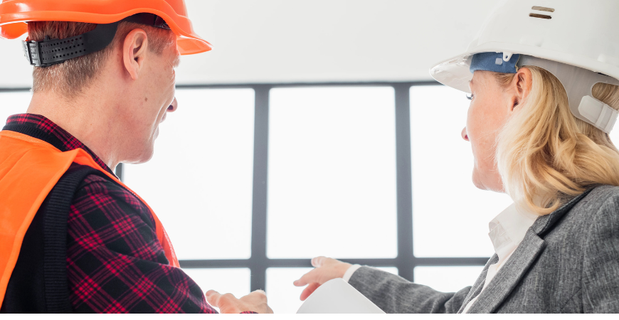 ADU construction manager discussing project plans on site – Best ADU LA