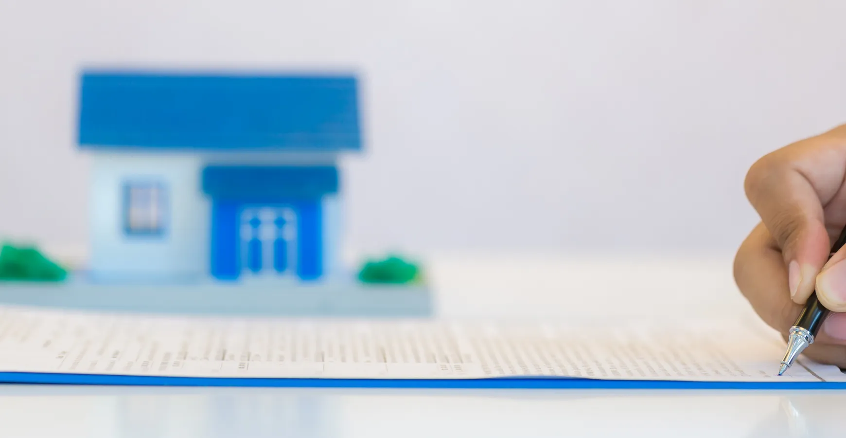 ADU permits and city approval in Los Angeles CA homeowner signing construction permit documents
