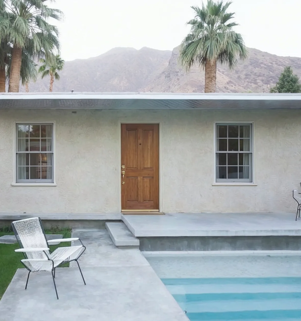 Attached ADU construction Los Angeles CA backyard home extension connected to main house with patio and poolside access