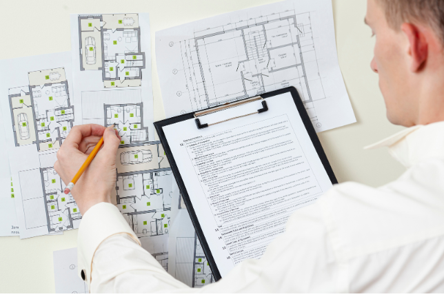 Architect preparing ADU building plans and permit documents – Best ADU LA