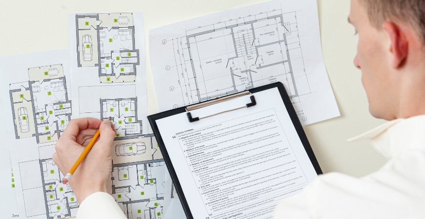 Architect reviewing ADU construction blueprints and permit plans – Best ADU LA